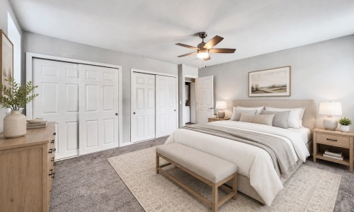 a bedroom with a bed and two nightstands